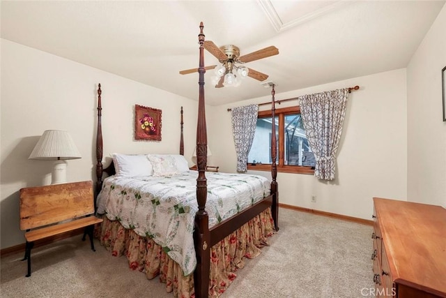 carpeted bedroom with baseboards and a ceiling fan