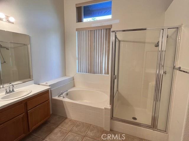 11950 Reichling Ln, Whittier, CA 90606 - bathroom featuring a shower stall, tile patterned floors, a garden tub, and vanity