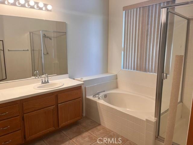 11950 Reichling Ln, Whittier, CA 90606 - bathroom featuring a shower stall, tile patterned floors, vanity, and a bath