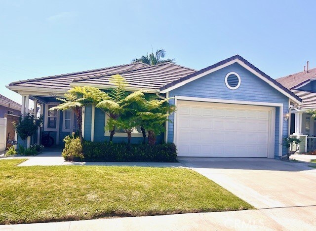 11950 Reichling Ln, Whittier, CA 90606 - ranch-style home with a tile roof, an attached garage, a front lawn, and concrete driveway