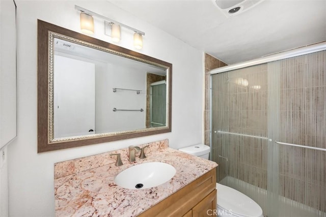 778 La Tierra St Unit H102, Corona, CA 92879 - full bathroom with toilet, vanity, and a tile shower