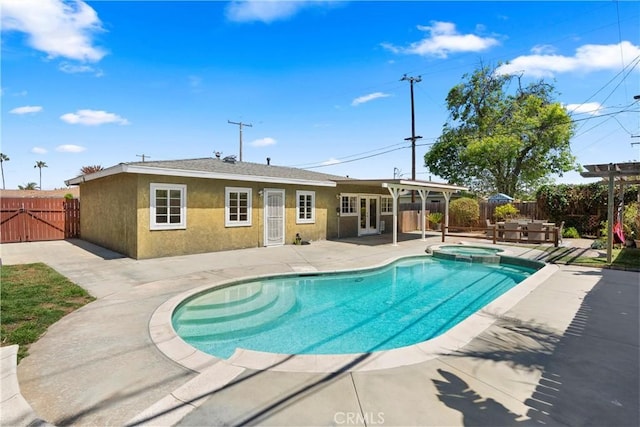 view of swimming pool with a fenced backyard, french doors, a gate, a patio area, and a pool with connected hot tub