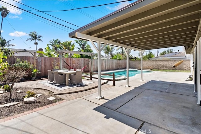 view of pool featuring outdoor dining area, a fenced backyard, a patio area, and a fenced in pool
