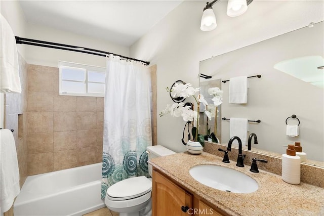 full bathroom featuring vanity, shower / bath combo, and toilet