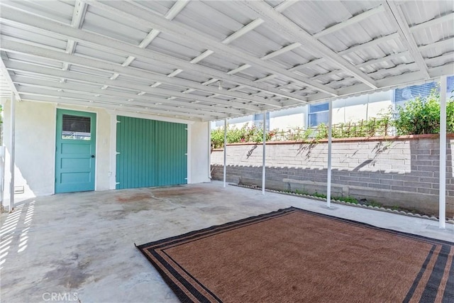 garage with fence