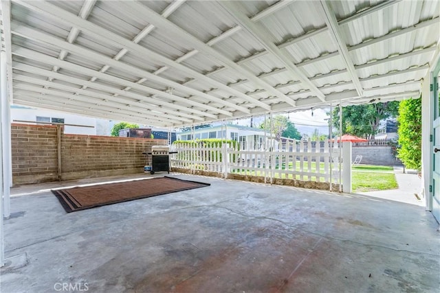 view of patio / terrace featuring a grill and fence