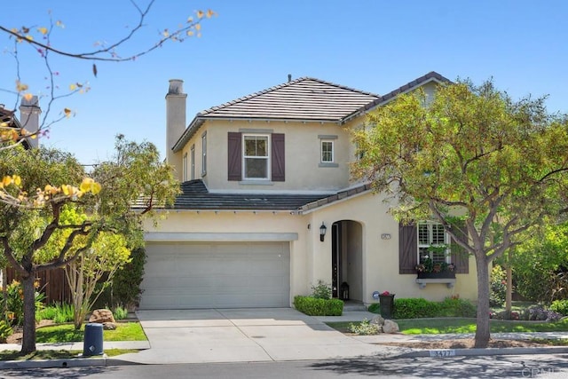 3477 Filoli Cir, Carlsbad, CA 92009 - view of front facade featuring driveway, a chimney, stucco siding, a garage, and a tiled roof