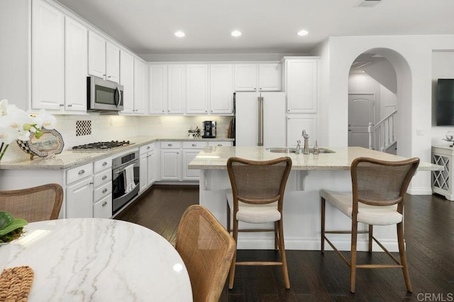 3477 Filoli Cir, Carlsbad, CA 92009 - kitchen with stainless steel appliances, a sink, dark wood-style flooring, and recessed lighting