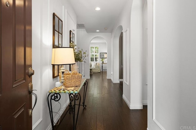 3477 Filoli Cir, Carlsbad, CA 92009 - corridor with arched walkways, dark wood finished floors, baseboards, and recessed lighting