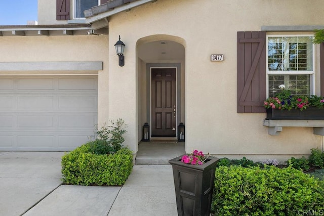 3477 Filoli Cir, Carlsbad, CA 92009 - property entrance featuring stucco siding and a garage