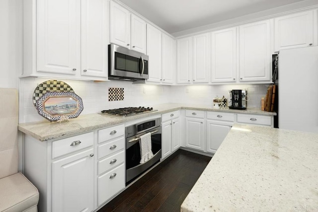 3477 Filoli Cir, Carlsbad, CA 92009 - kitchen featuring stainless steel appliances, dark wood finished floors, white cabinetry, and light stone countertops