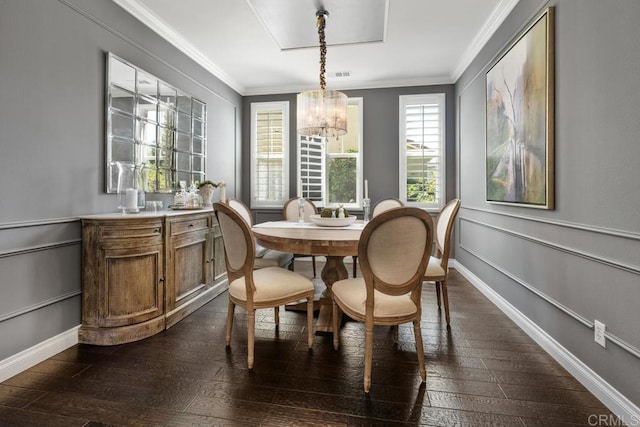 3477 Filoli Cir, Carlsbad, CA 92009 - dining area with a chandelier, crown molding, dark wood-style flooring, and baseboards