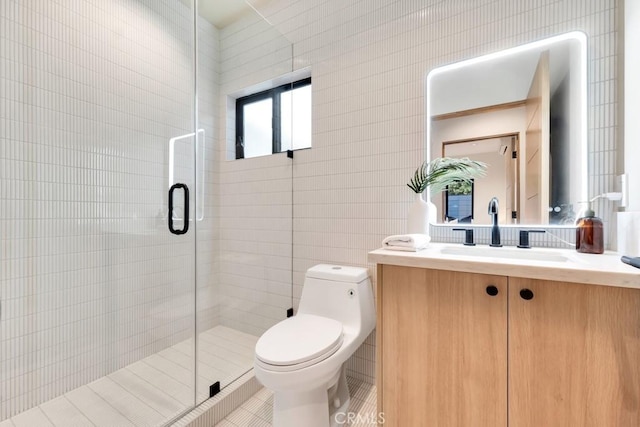 full bath featuring toilet, a stall shower, vanity, and tile patterned floors