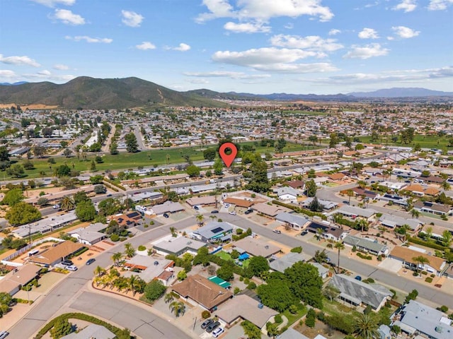 birds eye view of property with a mountain view and a residential view