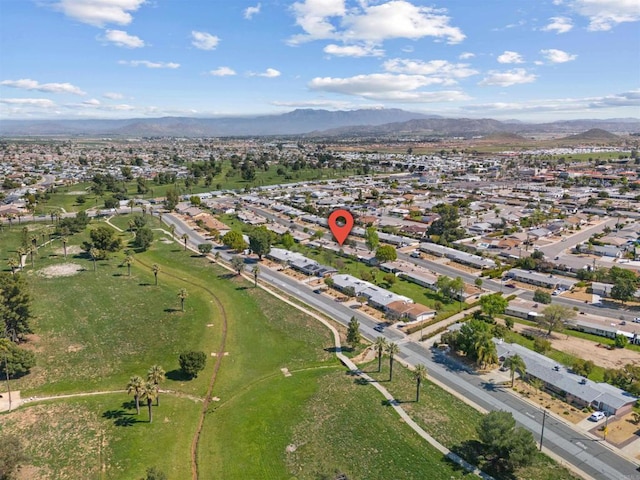 birds eye view of property with a mountain view and a residential view
