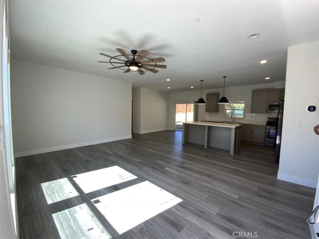 unfurnished living room featuring baseboards, recessed lighting, and a ceiling fan