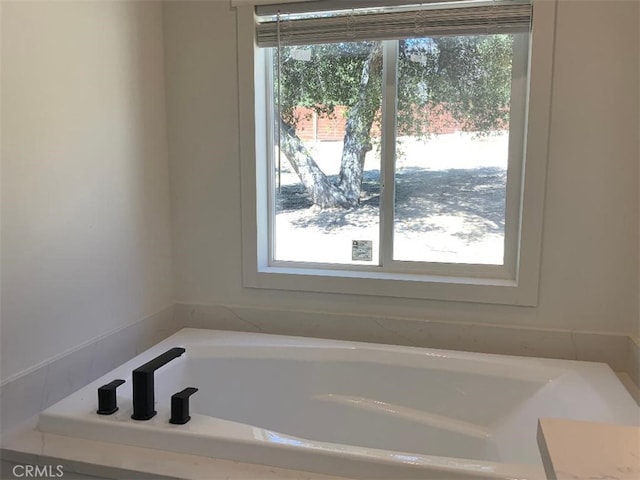 bathroom featuring a garden tub