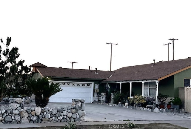 single story home with an attached garage and driveway