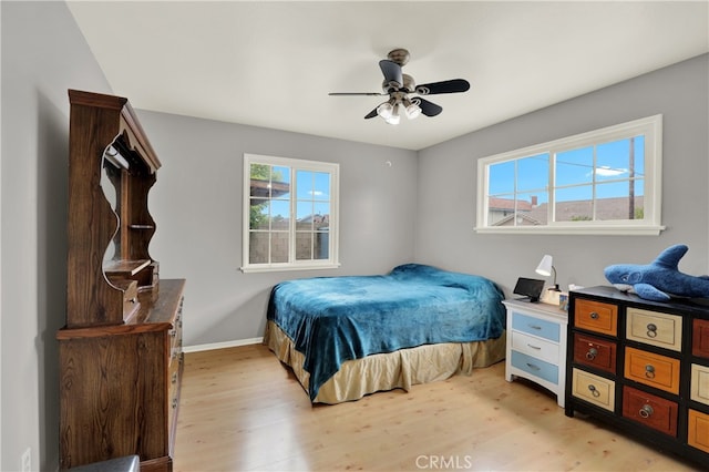 8731 Bel Air St, Buena Park, CA 90620 - bedroom with light wood-style floors, baseboards, and a ceiling fan