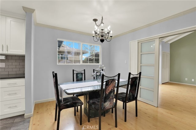 8731 Bel Air St, Buena Park, CA 90620 - dining area with a chandelier, light wood-style flooring, ornamental molding, and baseboards