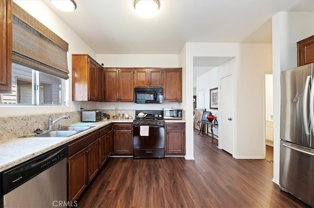 5166 Contay Way, Jurupa Valley, CA 92509 - kitchen featuring black appliances, a sink, dark wood-style floors, light countertops, and baseboards