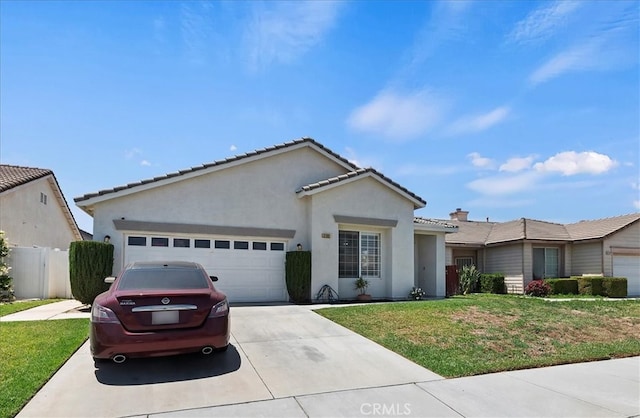 5166 Contay Way, Jurupa Valley, CA 92509 - single story home featuring a garage, driveway, stucco siding, and a tile roof