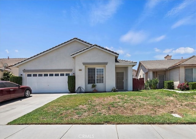 5166 Contay Way, Jurupa Valley, CA 92509 - ranch-style house with an attached garage, concrete driveway, stucco siding, and a tile roof