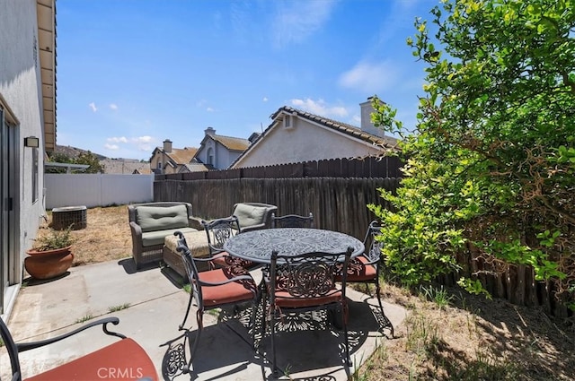 5166 Contay Way, Jurupa Valley, CA 92509 - fenced backyard with a patio area, central air condition unit, and outdoor dining area