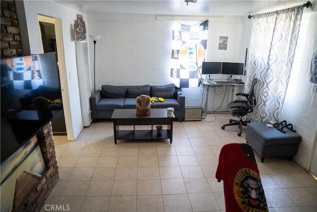 9925 Woodrich Ln, El Monte, CA 91731 - living room with light tile patterned floors and concrete block wall