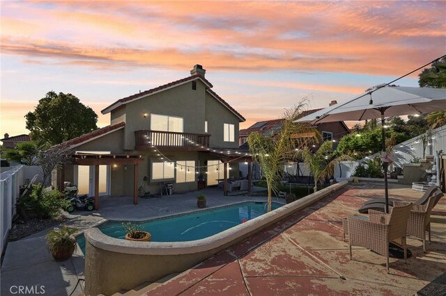 view of pool featuring a patio area, a fenced backyard, and a fenced in pool