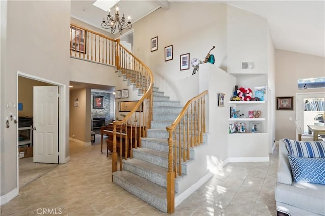 40540 Windsor Rd, Temecula, CA 92591 - stairs featuring high vaulted ceiling, a chandelier, and baseboards