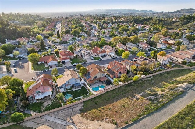 aerial view with a mountain view and a residential view