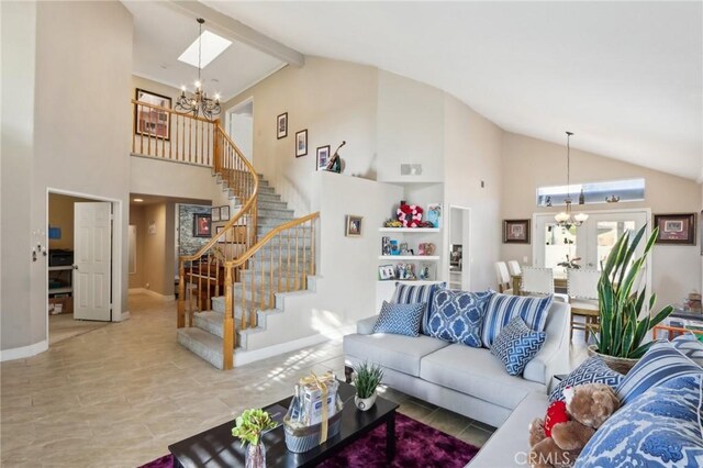 living area with high vaulted ceiling, baseboards, a chandelier, and stairway