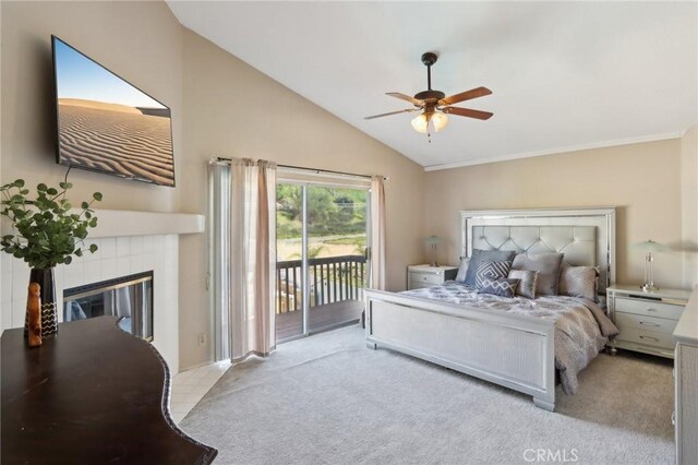 carpeted bedroom featuring a fireplace, access to outside, a ceiling fan, and high vaulted ceiling