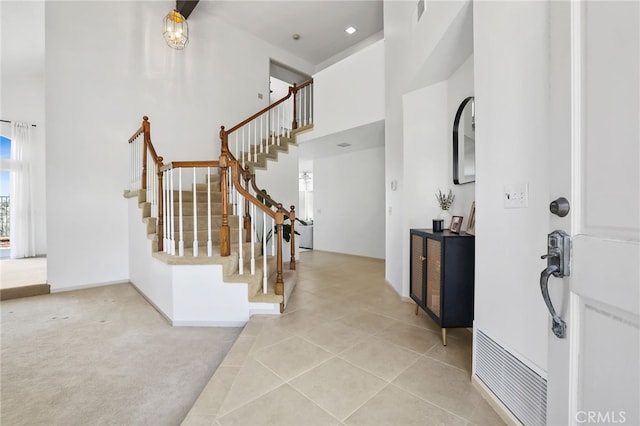17328 Cold Spring Cir, Riverside, CA 92503 - entryway featuring stairs, a towering ceiling, and light tile patterned flooring
