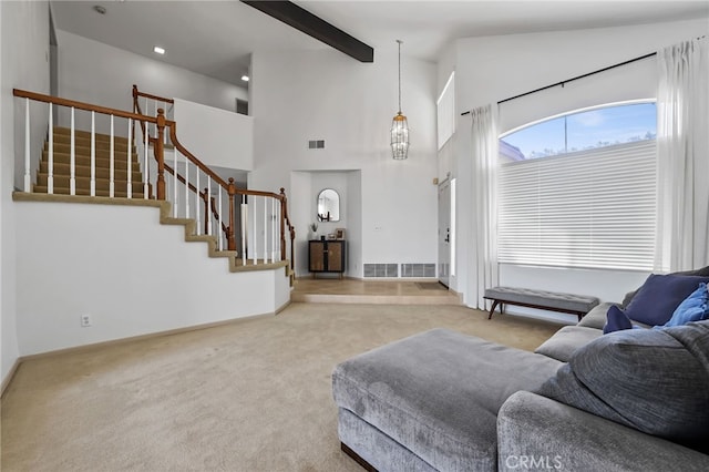 17328 Cold Spring Cir, Riverside, CA 92503 - living area featuring stairway, carpet flooring, beam ceiling, a towering ceiling, and baseboards