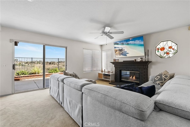 17328 Cold Spring Cir, Riverside, CA 92503 - living area with ceiling fan, a fireplace, and carpet floors