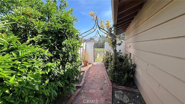 view of side of property featuring fence