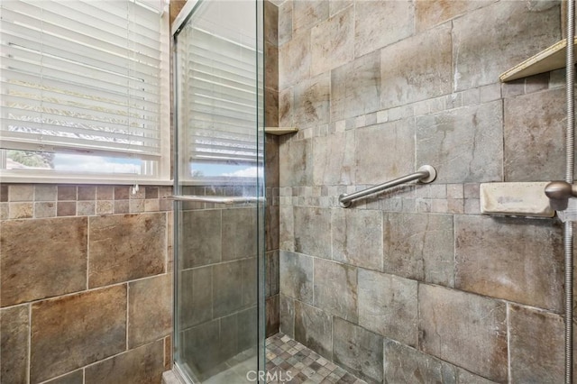 full bath featuring a tile shower