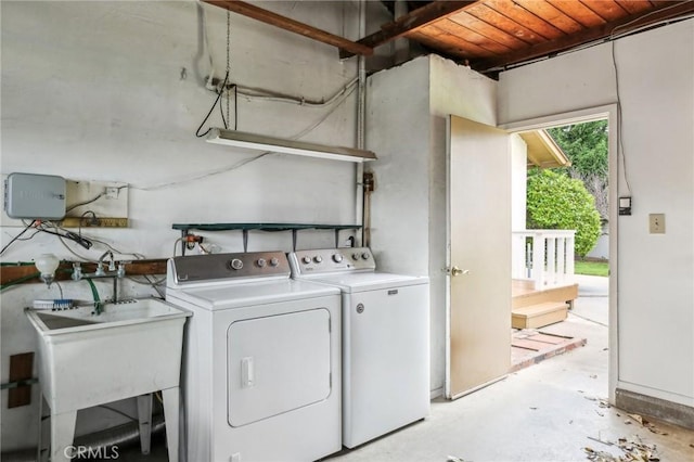 laundry room with independent washer and dryer and laundry area