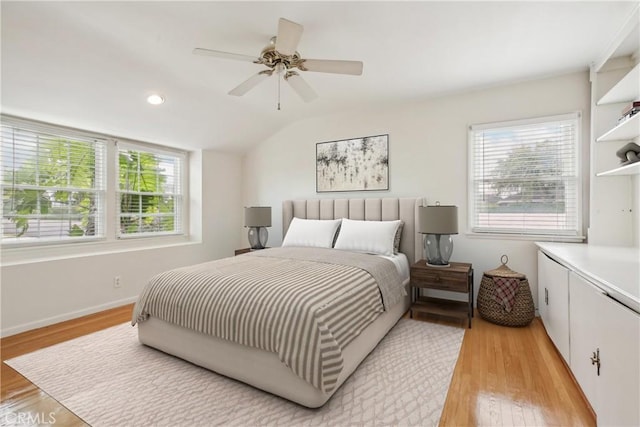 bedroom with baseboards, ceiling fan, recessed lighting, light wood finished floors, and vaulted ceiling
