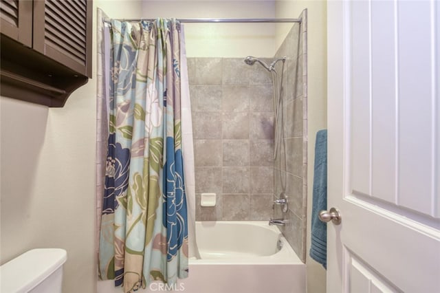 full bath featuring toilet and shower / bathtub combination with curtain