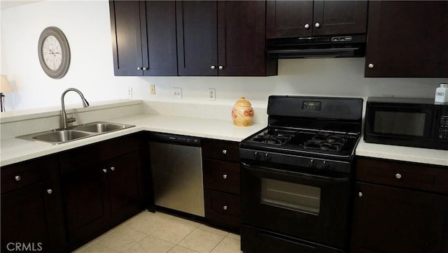 kitchen featuring a sink, black appliances, light countertops, under cabinet range hood, and light tile patterned floors