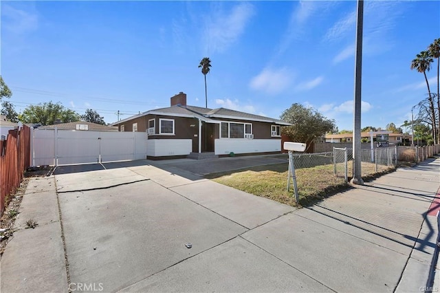 view of front of house with a gate and a fenced front yard