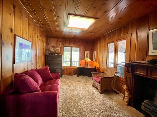 39121 Lake Dr, Bass Lake, CA 93604 - living area featuring wood walls, wood ceiling, and carpet