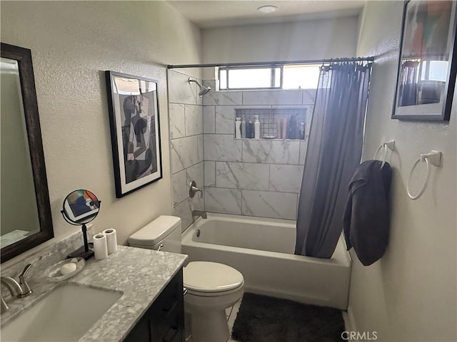 bathroom featuring shower / tub combo, vanity, and toilet