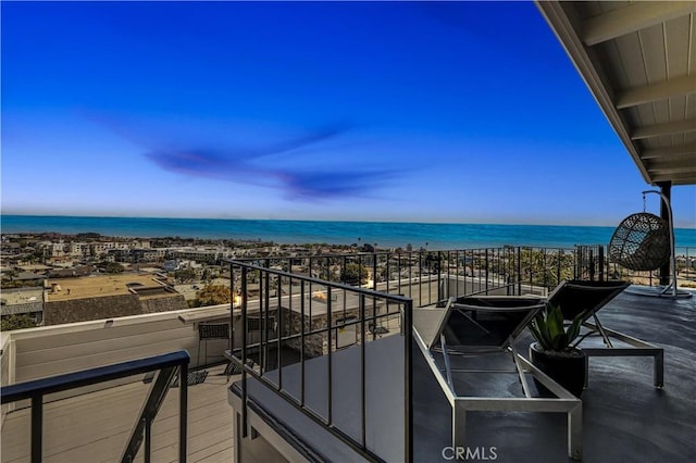 balcony featuring a water view