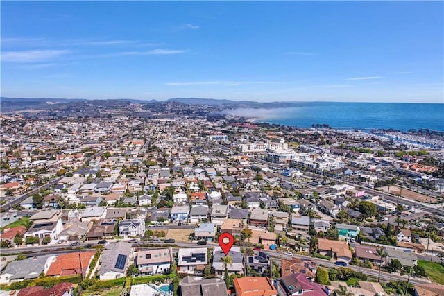 drone / aerial view featuring a water view and a residential view
