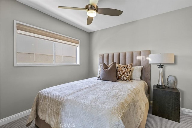 carpeted bedroom with baseboards and ceiling fan