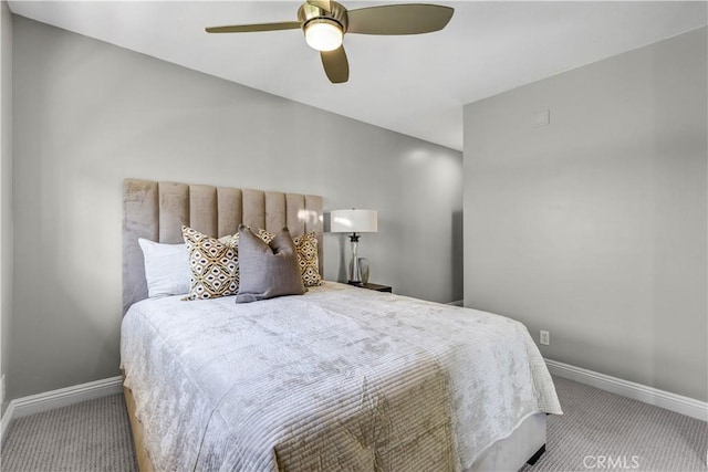 bedroom with ceiling fan, baseboards, and carpet floors